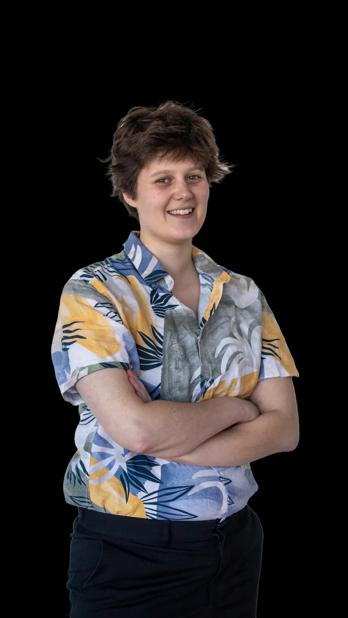 Alex Christiaens, dressed in a suit and smiling for the camera.