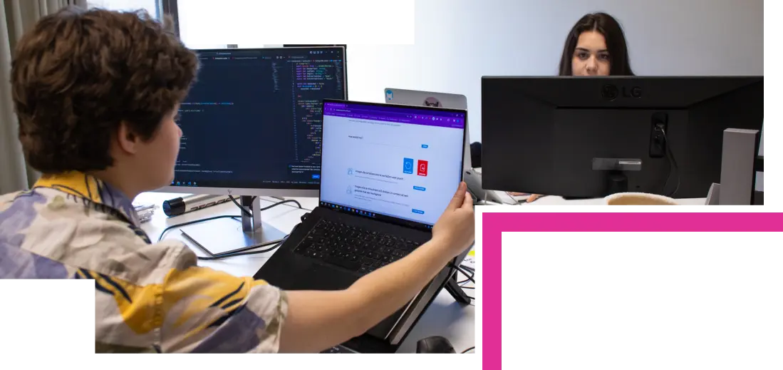 Alex and Shannon programming behind their screens